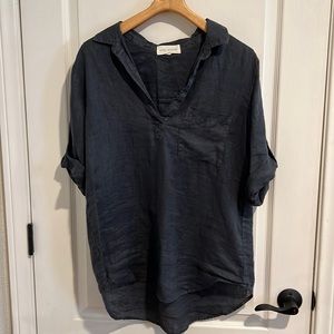 EUC Ladies Side Stitch Linen roll sleeve tunic top in a denim blue color.